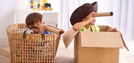 kids playing in cardboard boxes